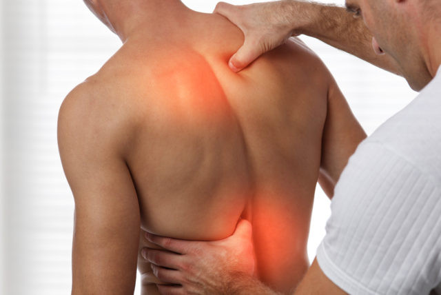Acupressure, back pain relief concept. Male patient Physiotherapy, Injury Rehabilitation treatment